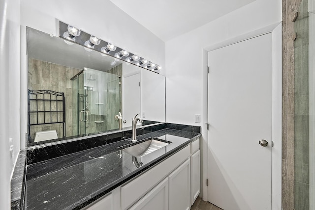full bathroom featuring vanity and a stall shower