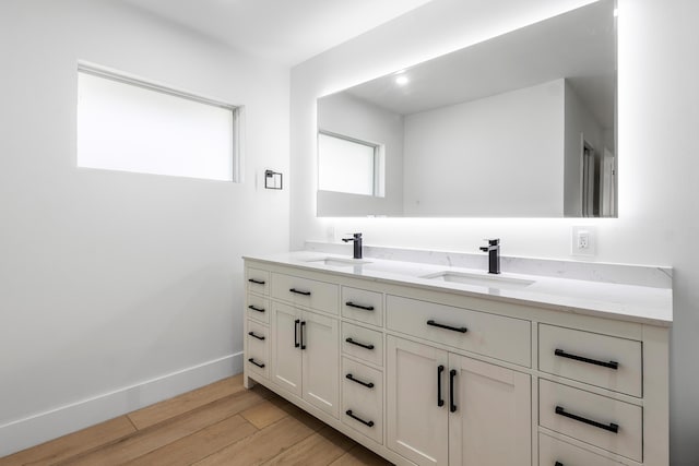 654 Lakewoode Cir W, Delray Beach, FL 33445 - bathroom with double vanity and wood finished floors