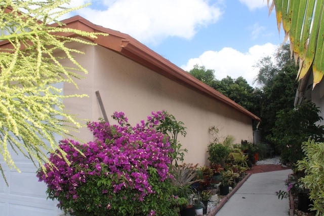 view of side of property featuring stucco siding