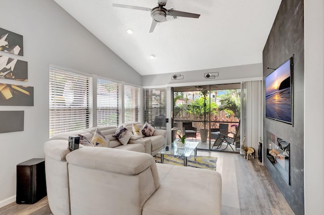 21687 Cromwell Cir, Boca Raton, FL 33486 - living area featuring light wood-type flooring, recessed lighting, high vaulted ceiling, a ceiling fan, and a fireplace