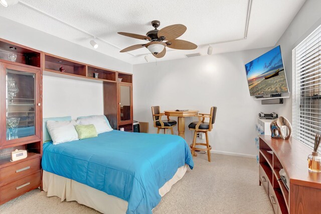 21687 Cromwell Cir, Boca Raton, FL 33486 - bedroom with light carpet, a textured ceiling, visible vents, a ceiling fan, and track lighting
