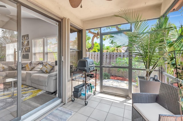 21687 Cromwell Cir, Boca Raton, FL 33486 - sunroom featuring a ceiling fan, a wood stove, and an outdoor living space