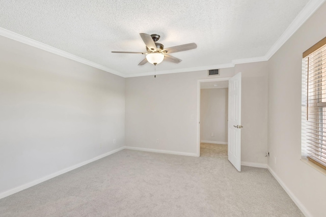 unfurnished room featuring visible vents, light colored carpet, a ceiling fan, and a textured ceiling