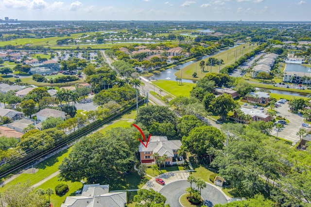 drone / aerial view with a residential view and a water view