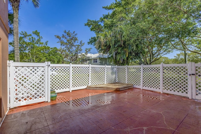 view of patio / terrace featuring fence