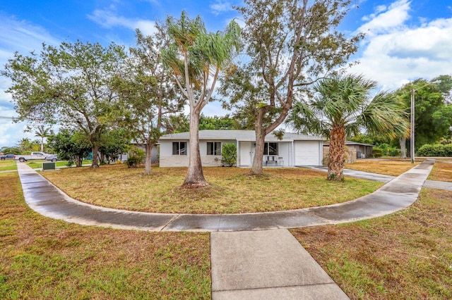 12036 Acapulco Ave, Palm Beach Gardens, FL 33410 - ranch-style house with a garage, concrete driveway, and a front lawn