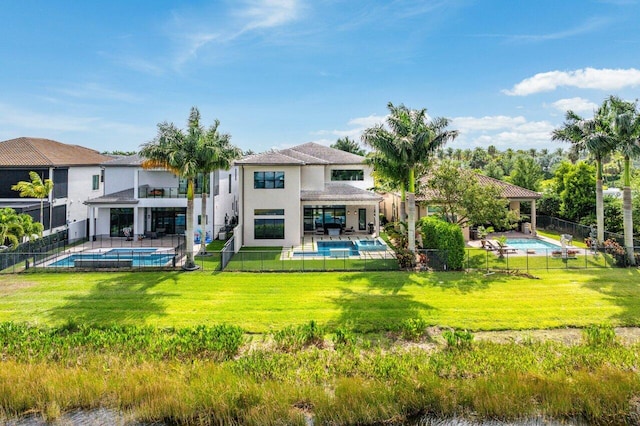 17165 Abruzzo Ave, Boca Raton, FL 33496 - rear view of house with a fenced in pool, a patio, a balcony, and a lawn