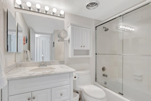 1625 Bridgewood Dr, Boca Raton, FL 33434 - bathroom with combined bath / shower with glass door, toilet, visible vents, and vanity