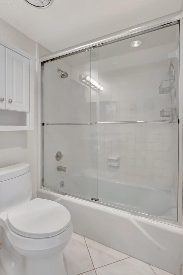 1625 Bridgewood Dr, Boca Raton, FL 33434 - full bath featuring bath / shower combo with glass door, tile patterned floors, and toilet