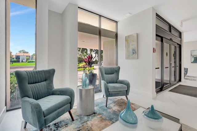 1625 Bridgewood Dr, Boca Raton, FL 33434 - sitting room featuring baseboards