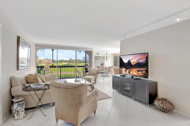1625 Bridgewood Dr, Boca Raton, FL 33434 - living area with rail lighting, baseboards, and light tile patterned flooring