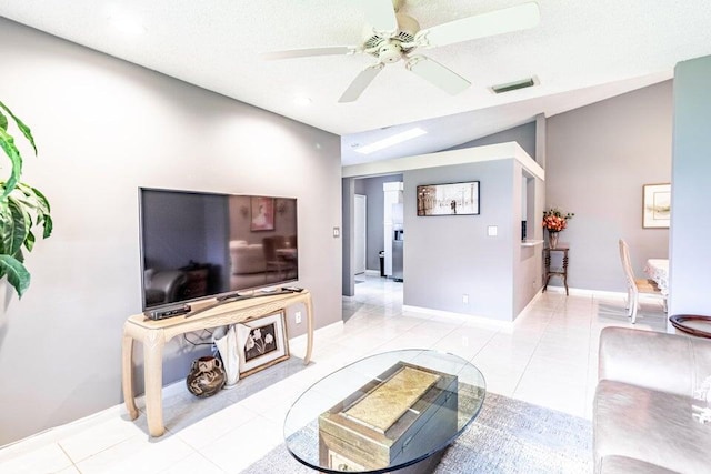 living area featuring visible vents, a ceiling fan, light tile patterned floors, and lofted ceiling