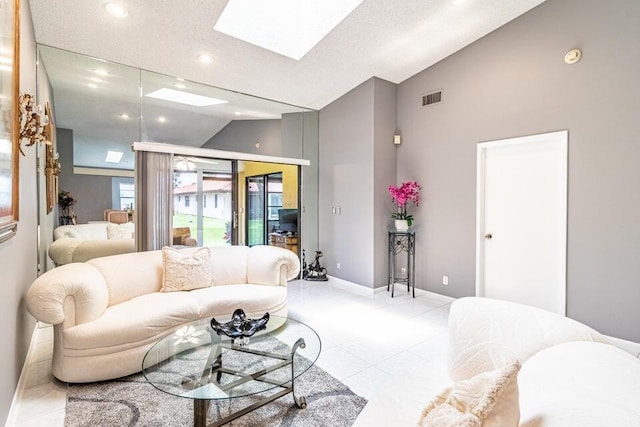 living room featuring baseboards, recessed lighting, light tile patterned floors, visible vents, and lofted ceiling with skylight