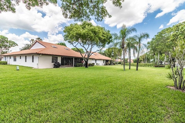 view of yard with a sunroom