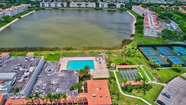 birds eye view of property with a water view