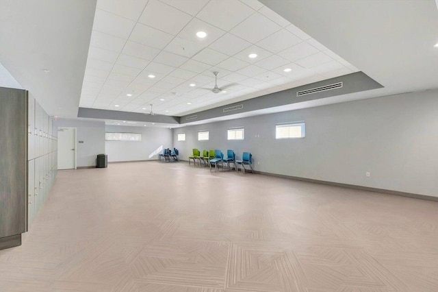 exercise room with baseboards, visible vents, and recessed lighting
