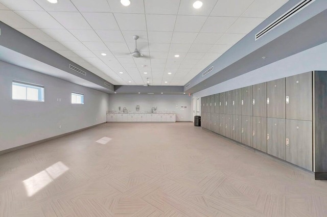 basement with recessed lighting, visible vents, and baseboards