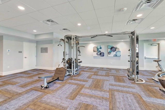 workout area featuring carpet flooring, baseboards, and visible vents