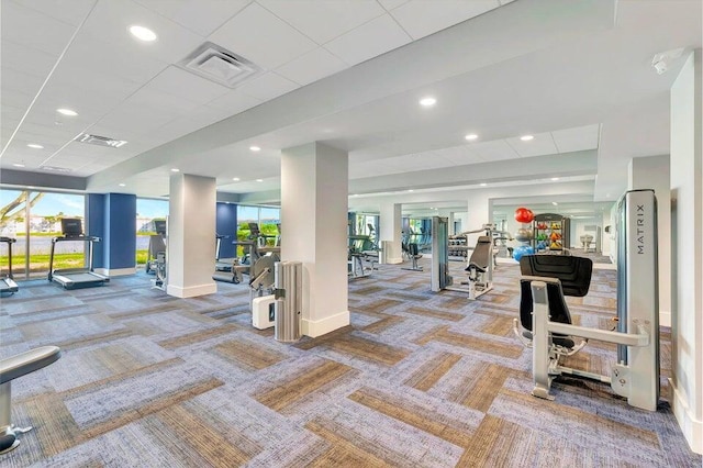 workout area featuring recessed lighting, carpet flooring, visible vents, and baseboards