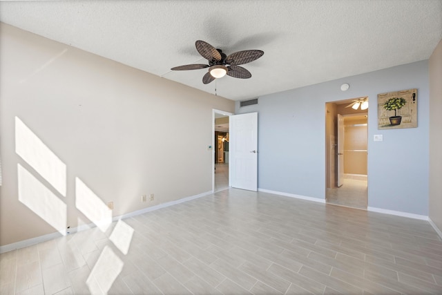 336 Golfview Rd Unit 916, North Palm Beach, FL 33408 - empty room with a textured ceiling, ceiling fan, baseboards, and visible vents