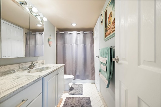 336 Golfview Rd Unit 916, North Palm Beach, FL 33408 - bathroom featuring tile patterned flooring, shower / bath combo with shower curtain, vanity, and toilet