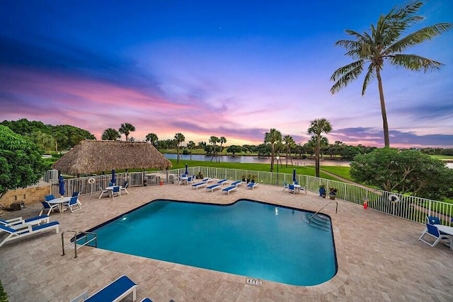 336 Golfview Rd Unit 916, North Palm Beach, FL 33408 - community pool featuring a patio area, fence, and a water view
