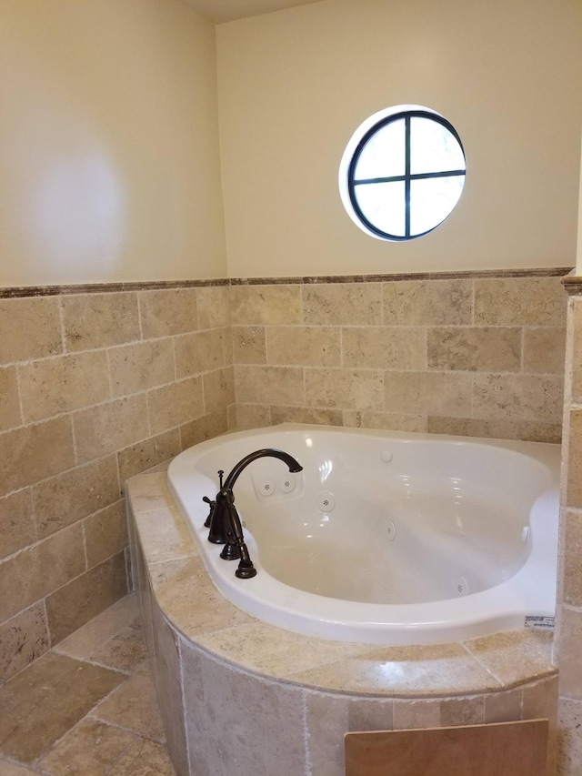 bathroom with a jetted tub