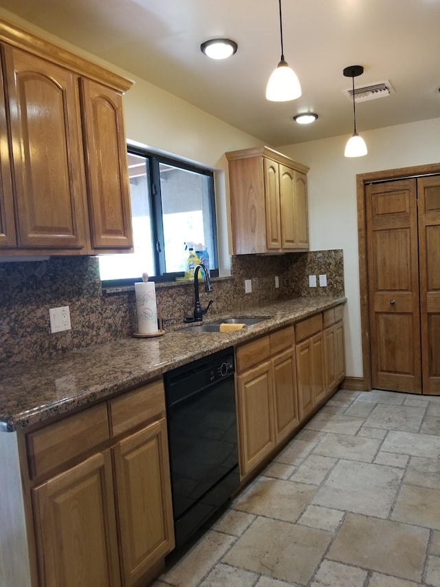 kitchen featuring decorative light fixtures, black dishwasher, a sink, stone tile flooring, and backsplash