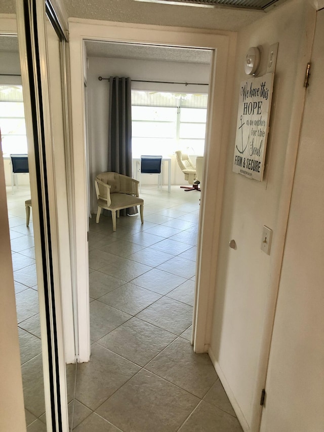 hallway with light tile patterned flooring