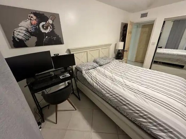 600 Executive Center Dr Unit 106, West Palm Beach, FL 33401 - bedroom with light tile patterned floors and visible vents