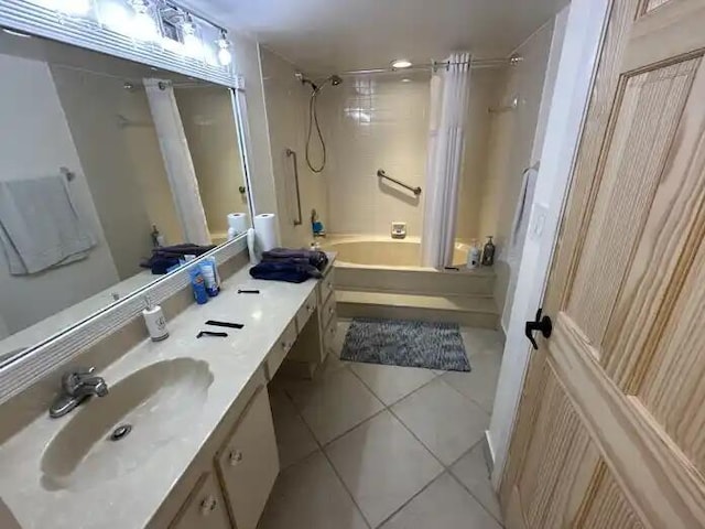600 Executive Center Dr Unit 106, West Palm Beach, FL 33401 - bathroom featuring shower / bath combo with shower curtain, tile patterned flooring, and vanity