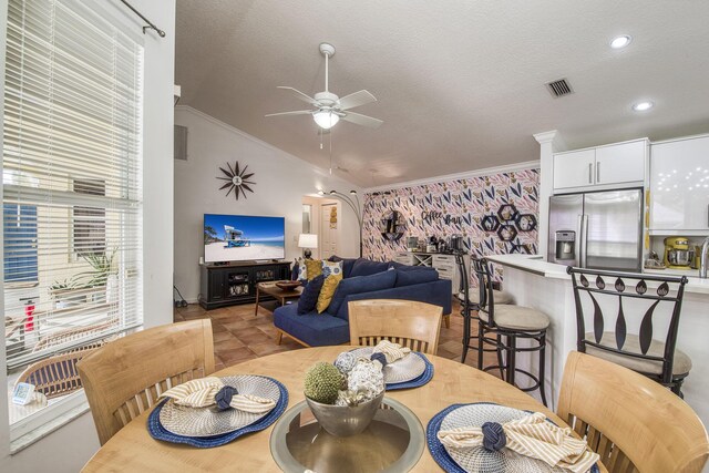 104 Cove Rd, Greenacres, FL 33413 - dining room with vaulted ceiling, ceiling fan, crown molding, recessed lighting, and a textured ceiling