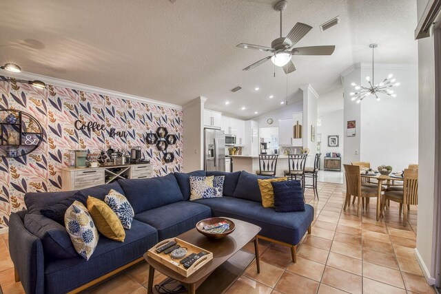 living area featuring ornamental molding, lofted ceiling, light tile patterned flooring, a textured ceiling, and ceiling fan with notable chandelier