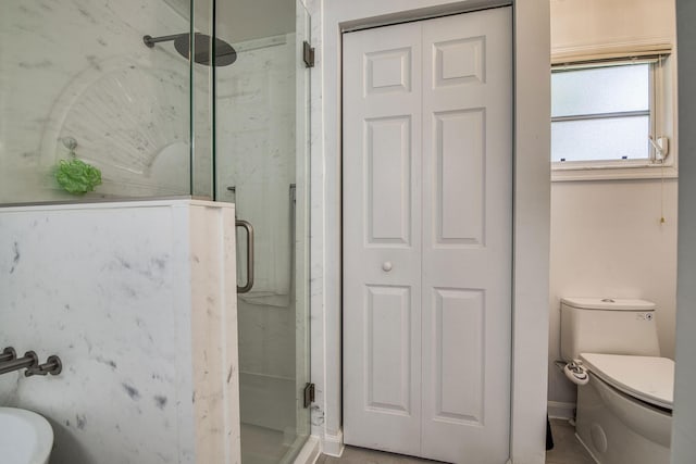 104 Cove Rd, Greenacres, FL 33413 - bathroom with a marble finish shower, toilet, and a closet
