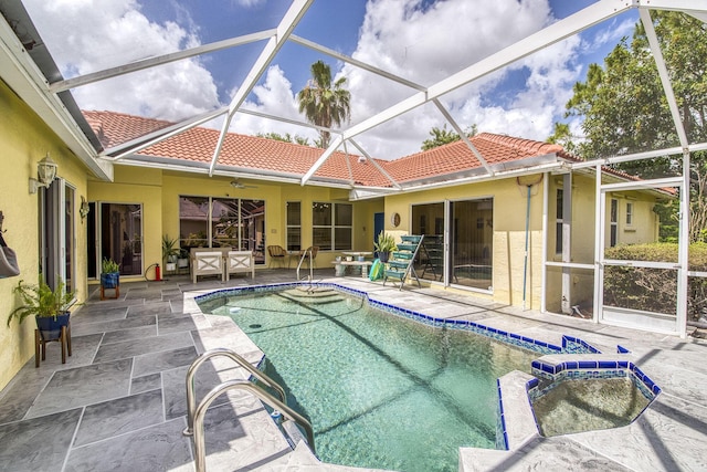 104 Cove Rd, Greenacres, FL 33413 - view of pool with a patio, a pool with connected hot tub, glass enclosure, and a ceiling fan