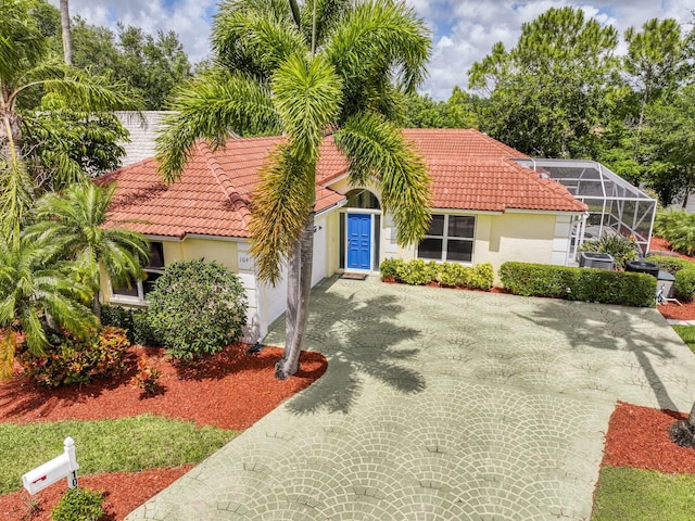 104 Cove Rd, Greenacres, FL 33413 - mediterranean / spanish house featuring a tile roof, driveway, stucco siding, and a garage