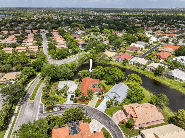 bird's eye view featuring a water view and a residential view
