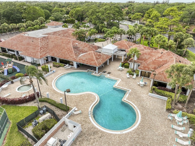 104 Cove Rd, Greenacres, FL 33413 - community pool with a patio area