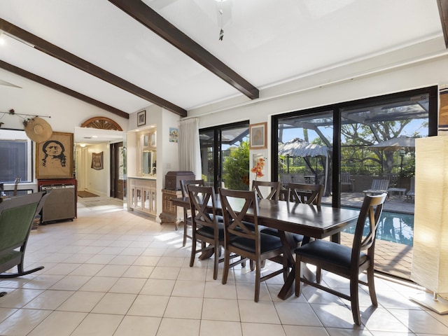 dining area featuring beamed ceiling, a wealth of natural light, high vaulted ceiling, and light tile patterned floors