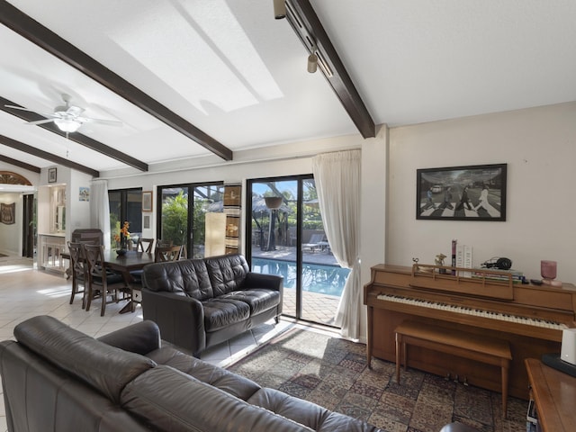 living area with a ceiling fan and beam ceiling