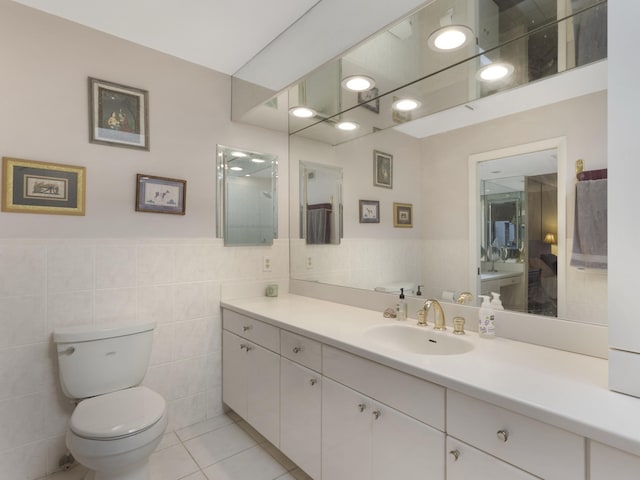 6582 Patio Ln, Boca Raton, FL 33433 - bathroom with toilet, tile walls, vanity, tile patterned flooring, and connected bathroom