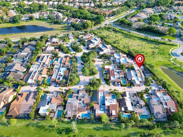 aerial view with a residential view and a water view