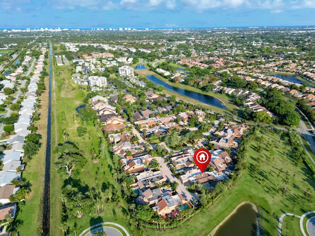 drone / aerial view with a residential view and a water view