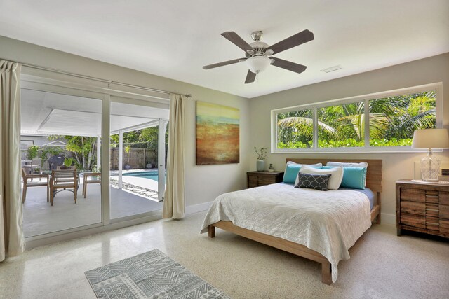 bedroom featuring access to exterior, baseboards, and a ceiling fan