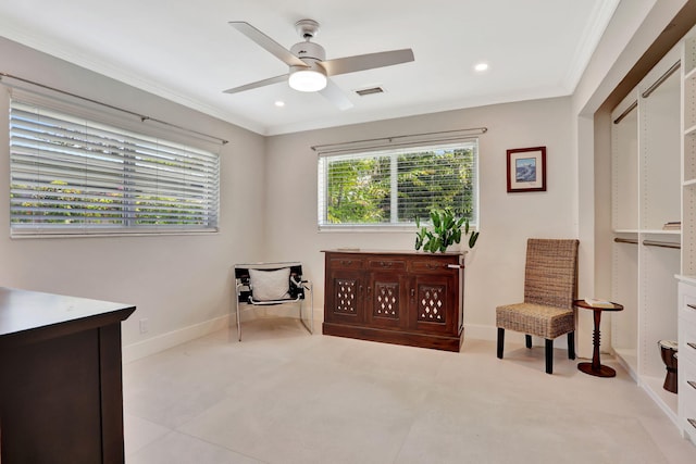 sitting room with ornamental molding, plenty of natural light, ceiling fan, recessed lighting, and baseboards