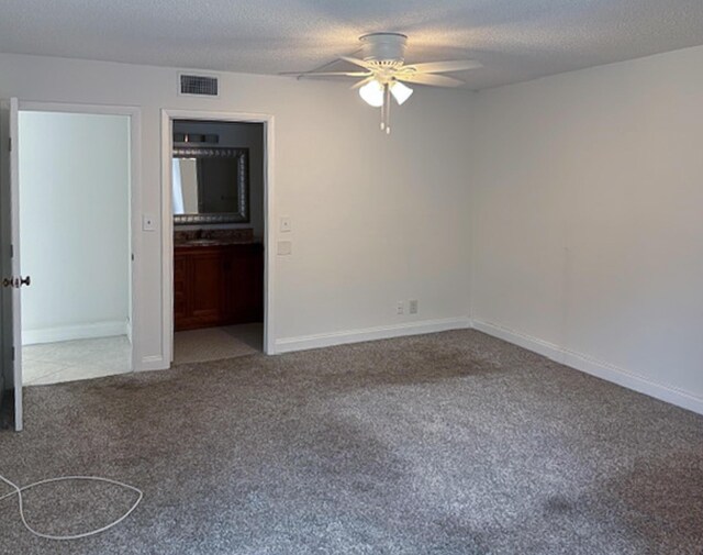 6935 Huntington Ln Unit 205, Delray Beach, FL 33446 - spare room with carpet floors, a ceiling fan, a textured ceiling, and baseboards