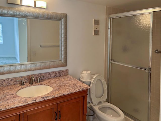 6935 Huntington Ln Unit 205, Delray Beach, FL 33446 - full bathroom featuring vanity, a stall shower, and toilet