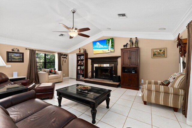 6045 Whipoorwill Ln, Fort Pierce, FL 34987 - living room featuring ceiling fan, a fireplace, vaulted ceiling, light tile patterned floors, and crown molding