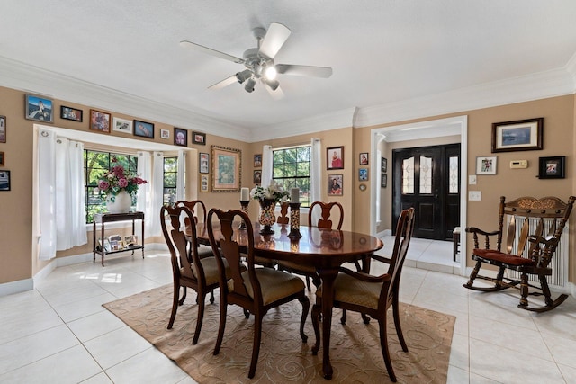 6045 Whipoorwill Ln, Fort Pierce, FL 34987 - dining space featuring light tile patterned floors, ceiling fan, crown molding, and baseboards