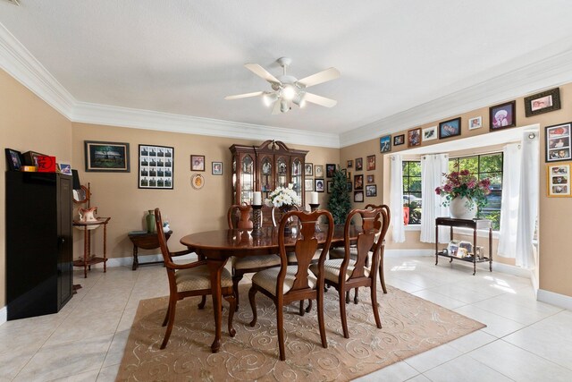 6045 Whipoorwill Ln, Fort Pierce, FL 34987 - dining room featuring light tile patterned floors, ceiling fan, crown molding, and baseboards